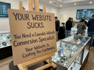 cardboard sign telling them how their website sucks