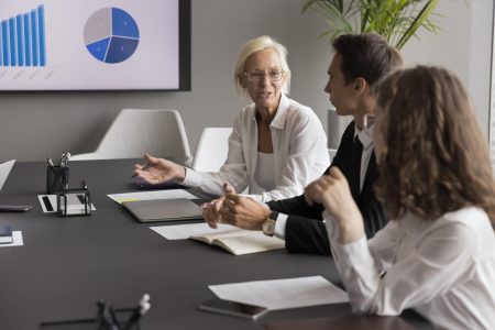 older woman teaching younger followers